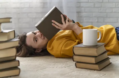 medium-shot-woman-holding-book