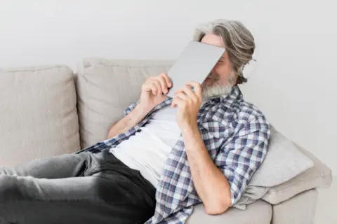 teacher-holding-tablet-close-face